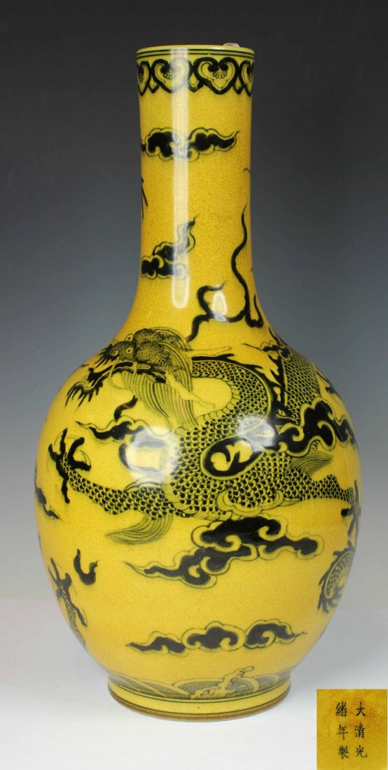 YELLOW VASE WITH BLACK DRAGON: yellow glazed, decorated with black dragon flying in the sky, with "Guang Xu" mark