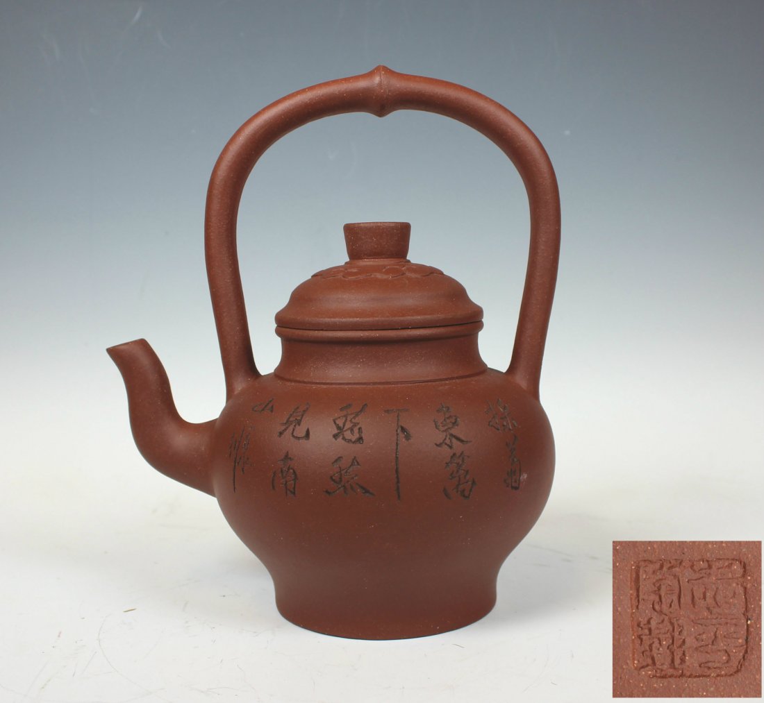 Zi Sha Tea Pot: with red brown ton, long neck round handle is attached.
