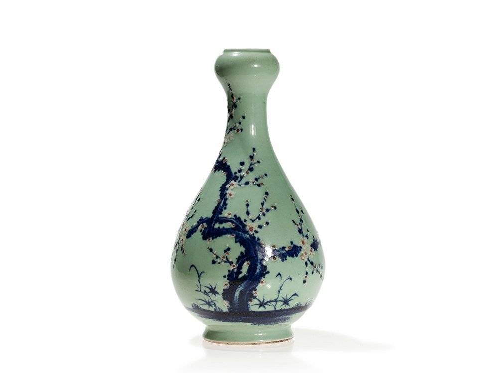 Celadon Ground Bottle Vase with Blue and Red, Qing,: Glazed porcelain, underglaze blue and copper red China, Qing dynasty (1644-1912), 19th century Pear-shaped body with a slender neck Archaic garlic shape Blossoming prunus branches, the petals picked o