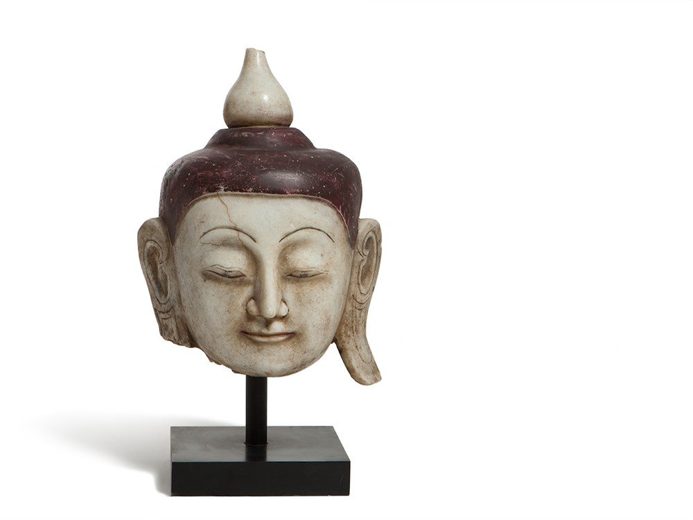 Noble Alabaster Head of Shan Buddha Burma, 18th / 19th: Alabaster, partially coloured Burma, 18th / 19th century Meditative expressions Extremely fine features Colour accentuation Bud shaped ketumala Dimensions: 40 x 28.5 cm (height x width) Provenance: fr