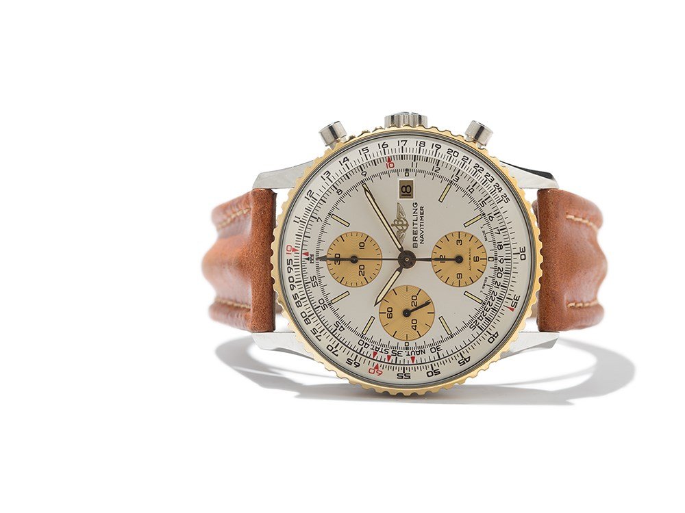 Breitling Navitimer Chronograph, Ref. 81610 BC, Around: Breitling Navitimer chronograph, ref. 81610 BC Switzerland, around 1990 Automatic movement, calibre ETA 7750; 17 jewels, hour, minute, second, date, chronograph White dial, gold hands Watch case and p