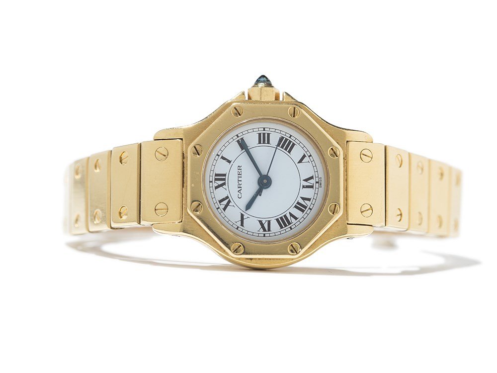 Cartier Santos Women’s Watch, Switzerland, Around 1990: Cartier Santos women’s watch Switzerland, around 1990 Automatic movement, hour, minute, second White dial, blued hands Watch case and folding clasp of 18K gold Cabochon crown Watch case and clasp ar