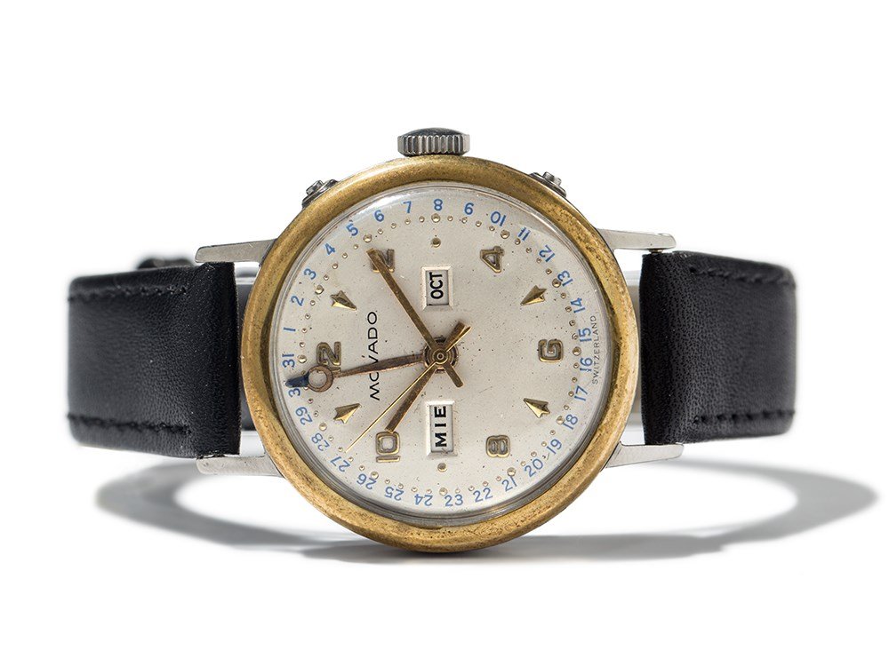Movado Datora Triple Date, Switzerland, Around 1950: Movado Datora Triple Date Switzerland, around 1950 Movado manufacture manual wind movement, hour, minute, second, full calendar Silver dial, gold hands Watch case of stainless steel Black leather stra