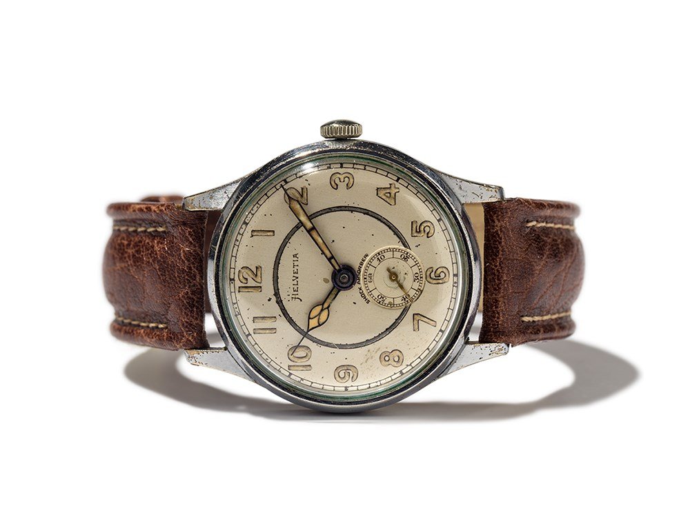 Helvetia Wristwatch, Switzerland, Around 1950: Helvetia wristwatch Switzerland, around 1950 Manual wind movement, HP calibre; 15 jewels, hour, minute, small second Silver dial, blued hands Watch case of stainless steel Brown leather strap with pin