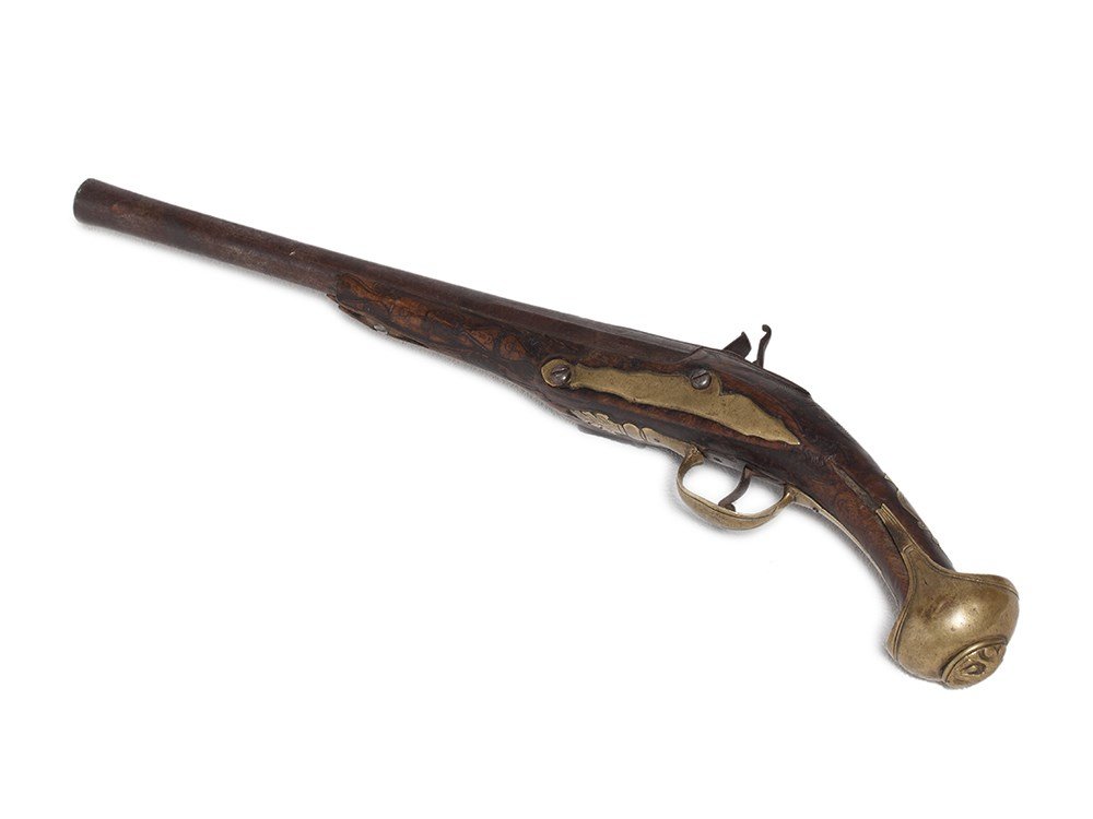 Flintlock Pistol with Carvings, Turkey, 17th Century: Wood, iron, brass Turkey, 17th century Wood body with carvings and brass fittings Overall length: 49 cm Provenance: Important Austrian private collection The present flintlock pistol comes from Turkey
