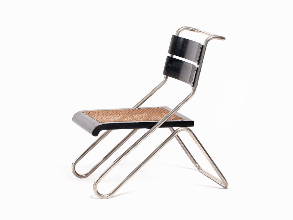 Erich Dieckmann, 8326 Tubular Steel Chair,: Chrome-plated tubular steel, curved plywood boards with black lacquer, ebonized wood, cane Germany, 1931; manufactured around 1931 Erich Dieckmann (1896-1944) - German designer Cebaso, Ohrdruf (Carl B