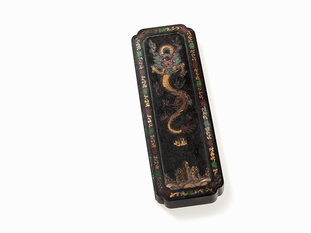 Decorated Ink Stone, Dragon in Relief, Daoguang Mark &: Pressed ink, lacquer, partly painted with pigments China, Daoguang period (1821-1850) On the back with the four character mark of the Daoguang period and an inscription Five-clawed dragon surrounded b