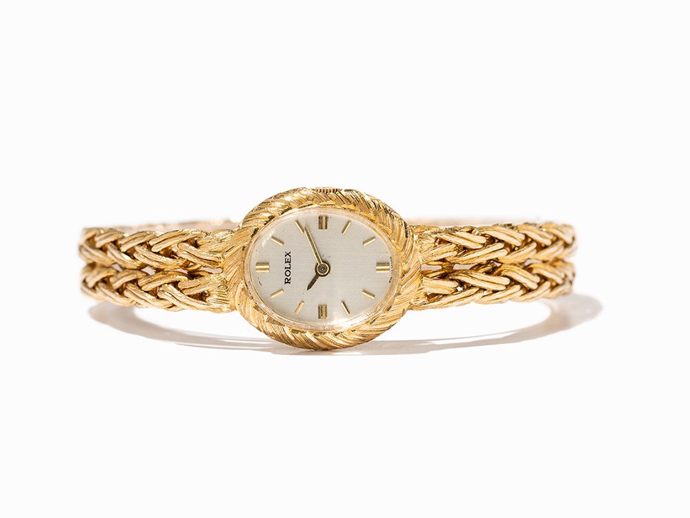 Rolex Women’s Watch, Ref. 598, Switzerland, Around 1960: Rolex women’s watch, ref. 598 Switzerland, around 1960 Manual wind movement, calibre 1400; 18 jewels, hour, minute Silver dial, gold hands Watch case, strap and folding clasp of 18K gold Watch case