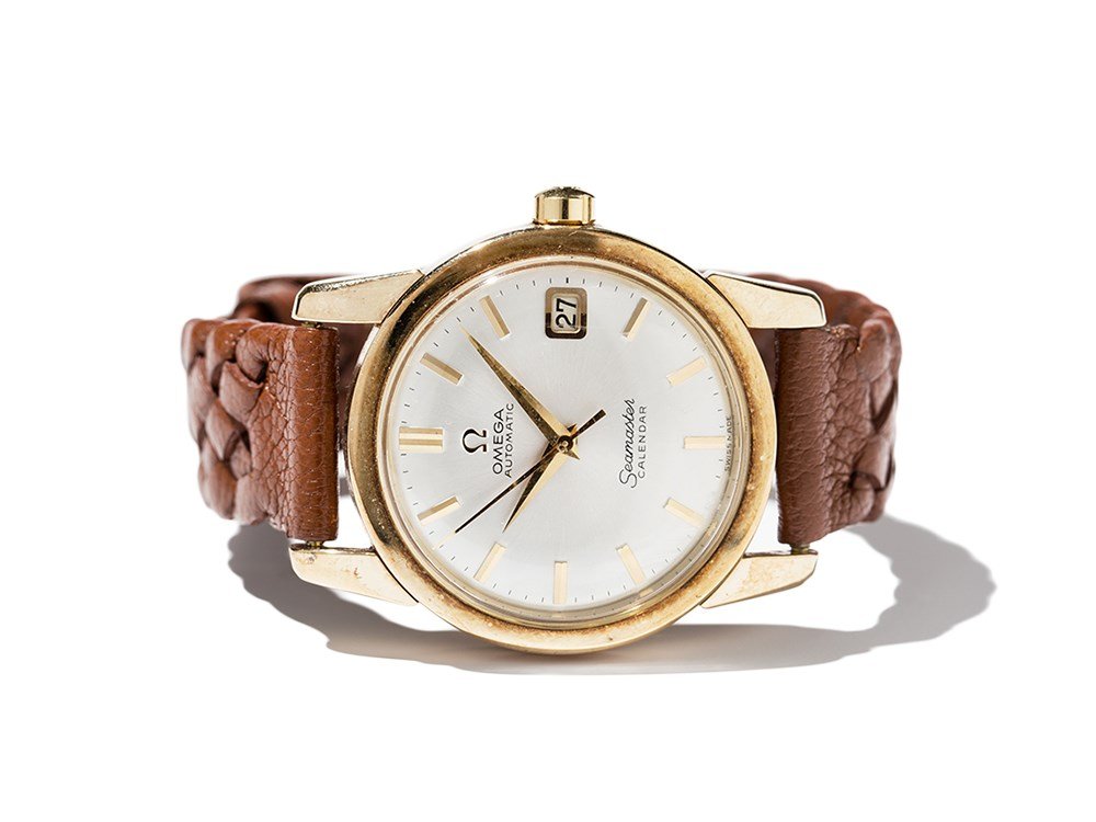 Omega Seamaster Calendar Wristwatch, Switzerland,: Omega â€œSeamasterâ€ Calendar wristwatch Switzerland, around 1975 Automatic movement, hour, minute, second, date Silver dial, gold hands Watch case and crown of gold Brown leather strap with pi