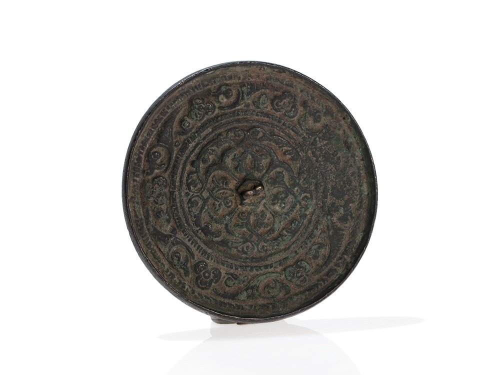 Bronze Mirror with Arabesque Decor, Khorasan, 12th/13th: Bronze Khorasan, 12th or 13th Century Floral relief decor with arabesque motif With old collection number (F.R. Martin) Diameter: 9 cm Weight: approx. 97 grams Good state of preservation Provenance: e