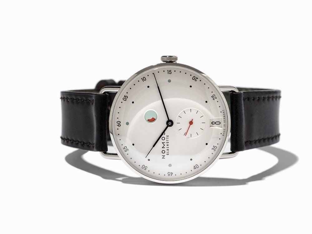 Nomos Metro 200 Wristwatch, Germany, Around 2014: Nomos Metro 200 wristwatch Germany, around 2014 Manual wind movement, calibre DUW 4401; 23 jewels, hour, minute, small second, date, power reserve Silver dial, black and one red hand Watch case and or