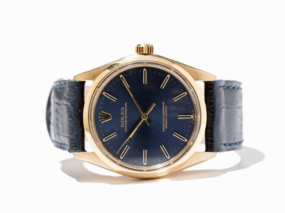 Rolex Oyster Perpetual Chronometer, Ref. 1002, Around: Rolex Oyster Perpetual chronometer, ref. 1002 Switzerland, around 1965 Automatic movement, calibre 1570; hour, minute, second Blue dial, gold hands Watch case of 18K gold Blue, Rolex leather strap wit