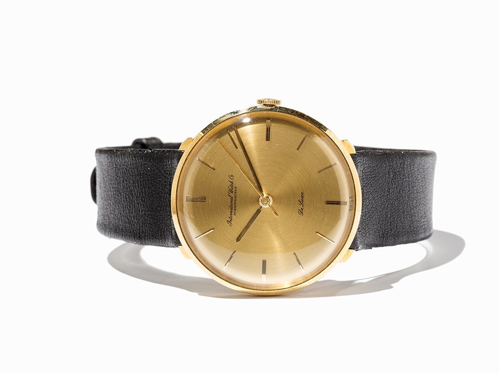 IWC Gold Wristwatch, Switzerland, Around 1965: IWC gold wristwatch Switzerland, around 1965 Manual wind movement, calibre 401; hour, minute, second Gold dial, gold hands Watch case of 18K gold Black leather strap with gold plated pin buckle Watch