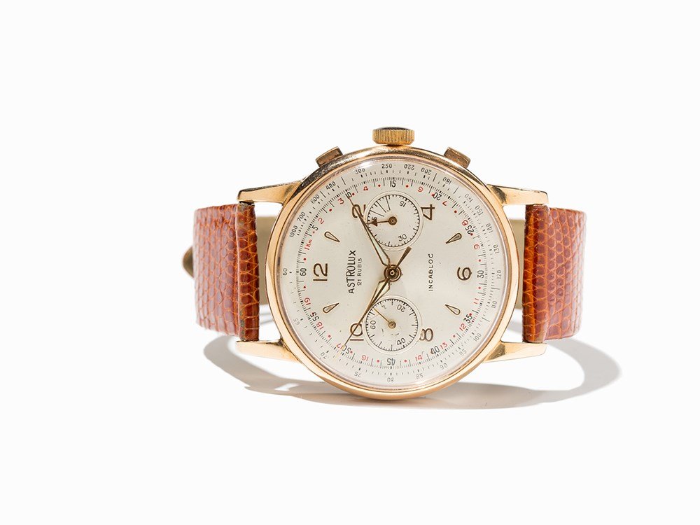 Astrolux Chronograph, Switzerland, Around 1950: Astrolux chronograph Switzerland, around 1950 Manual wind movement, calibre 92; hour, minute, second, chronograph Silver dial, gold hands Watch case of 18K rose gold, anti magnetic Brown leather strap