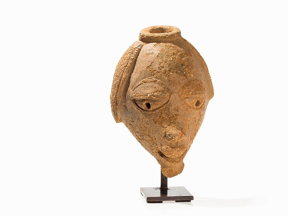 Nok, Terracotta Head Fragment, 1000 BC to 300 AD: Terracotta Nok people, Nigeria, 1000 BC to 300 AD Fragment of a head Elaborate terracotta work Height: 22 cm TL tested at the Rathgen laboratory in 1999 Good condition Provenance: Private collection, 