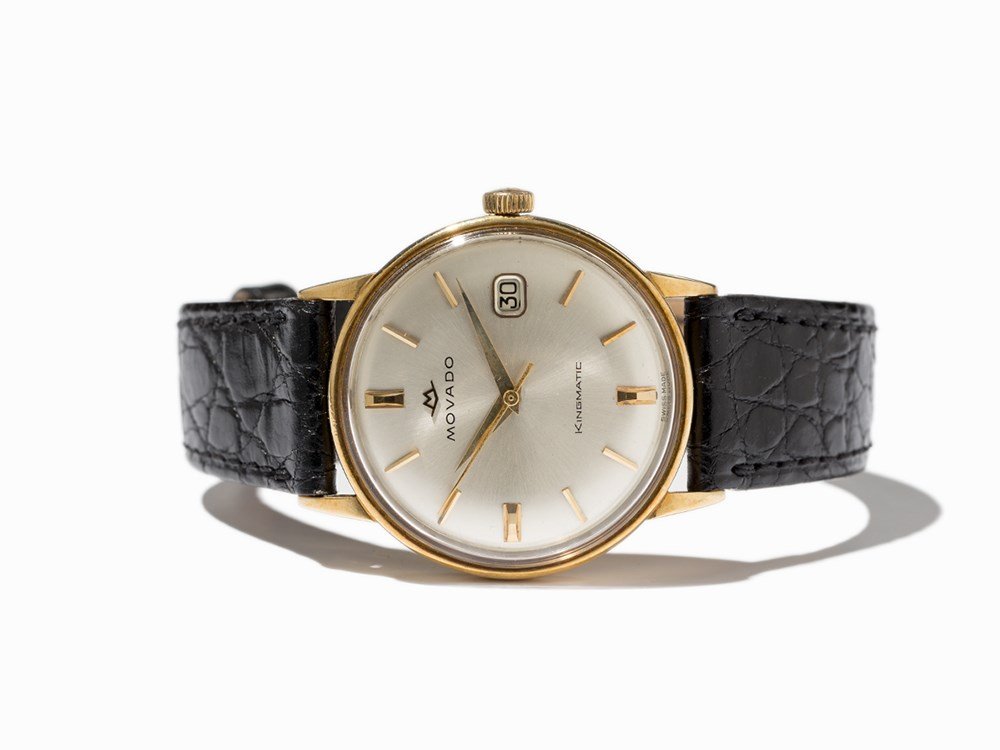 Movado Kingmatic Wristwatch, Switzerland, Around 1960: Movado Kingmatic wristwatch, ref. 5221 Switzerland, around 1960 Automatic movement, calibre 538; 28 jewels, hour, minute, second, date Silver dial, gold hands Watch case of 18K gold Black leather stra