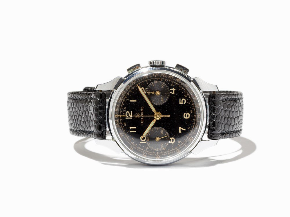 Helbros Chronograph, Switzerland, Around 1950: Helbros chronograph Switzerland, around 1950 Manual wind movement, calibre Venus 188; hour, minute, second, chronograph Black dial, gold hands Watch case of stainless steel Black leather strap with pi