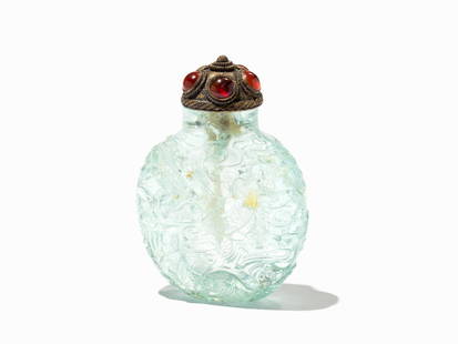 Aquamarine Snuff Bottle with Dragons in Relief, Qing: Aquamarine, translucent pale blue China, late Ding dynasty (1644-1911) Flattened circular shape Very well and wide hollowed body Narrow mouth and straight lip Flat base with continuation of the décor