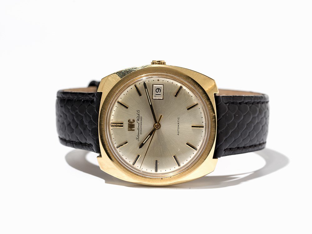 IWC Automatic Wristwatch, Switzerland, Around 1975: IWC automatic wristwatch Switzerland, around 1975 Automatic movement, hour, minute, second, date Silver dial, gold hands Watch case of 18K gold Black leather strap with pin buckle Watch case hallmarke