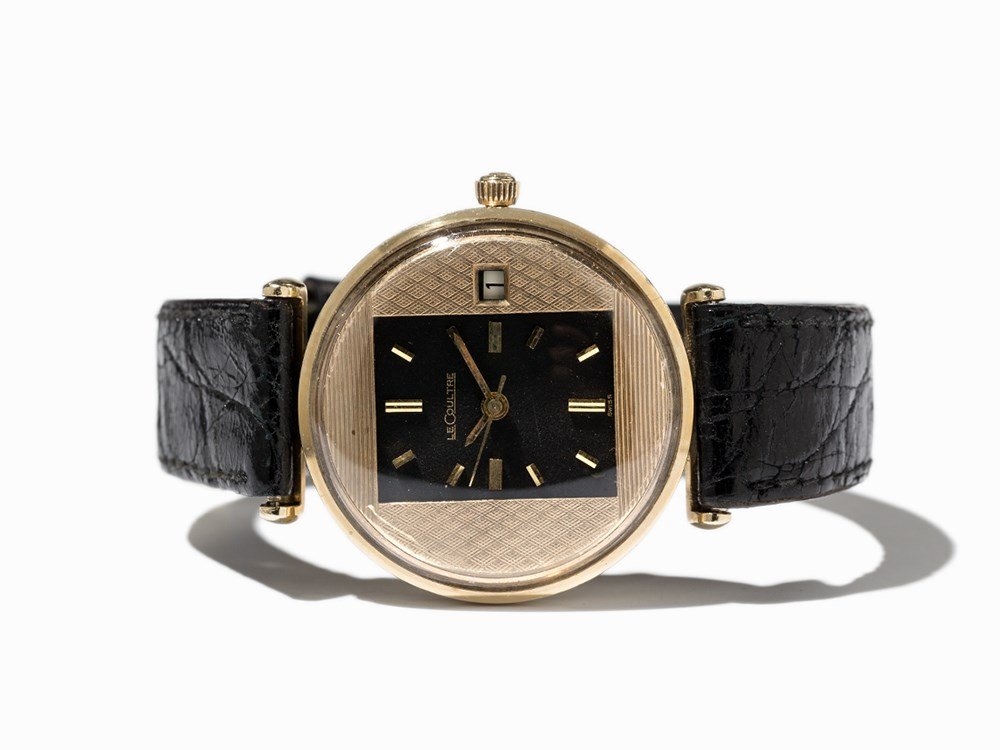 LeCoultre Wristwatch, Switzerland, Around 1955: LeCoultre wristwatch Switzerland, around 1955 Manual wind movement, hour, minute, second, date Black-gold dial, gold hands Watch case of 14K gold Black leather strap with original, gold plated pin buc