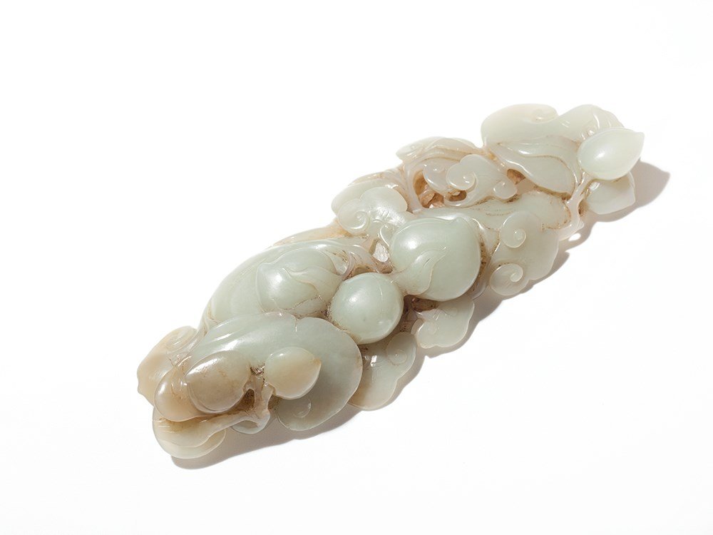 Large Celadon Jade Brush Rest, Qing: Celadon-colored Jade China, Qing dynasty (1644-1911) Fine and detailed carving on both sides It features three-dimensional peaches and Ling Zhi mushrooms, symbols of luck and immortality Partly openwo