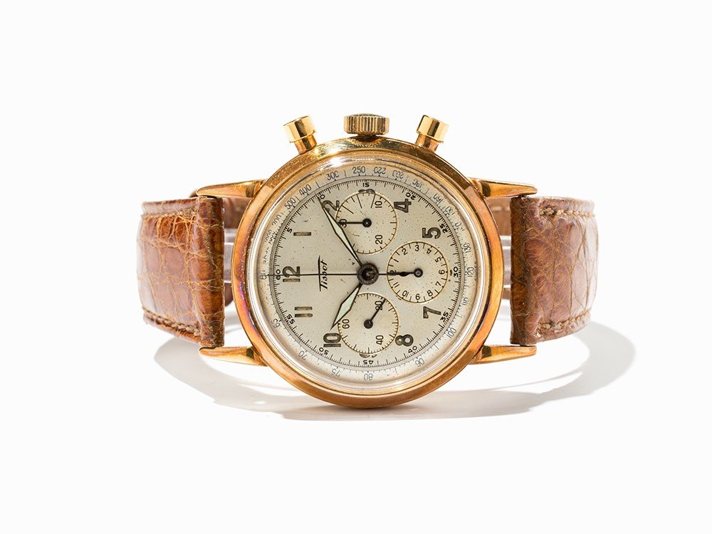 Tissot Gold Chronograph, Switzerland, Around 1945: Tissot gold chronograph Switzerland, around 1945 Manual wind movement, hour, minute, second, chronograph Silver dial, blued hands Watch case of 18K gold Brown alligator leather strap with gold plated