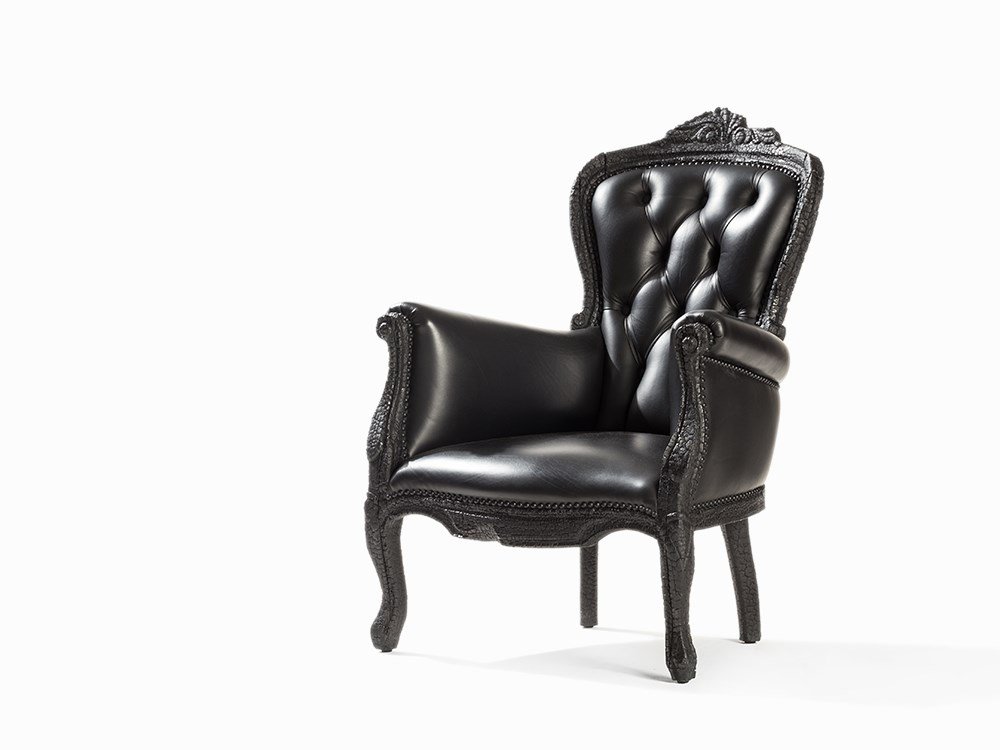 Maarten Baas, Moooi Smoke Chair, Netherlands, 2002: Burnt wood, epoxy, black leather, fabric Netherlands, 2002 Armchair in the baroque style Design: Maarten Baas (born 1978) - Dutch designer of German descent Manufacture: Moooi, established in Breda, H