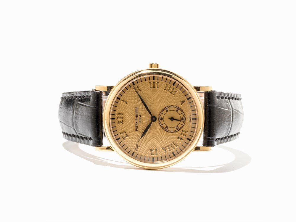 Patek Philippe Wristwatch, Ref. 5022, Switzerland,: Patek Philippe wristwatch, ref. 5022J-001 Switzerland, around 1999 Manual wind movement, calibre 215; 18 jewels, hour, minute, subsidiary second Gold dial, black hands Watch case and original pin buck