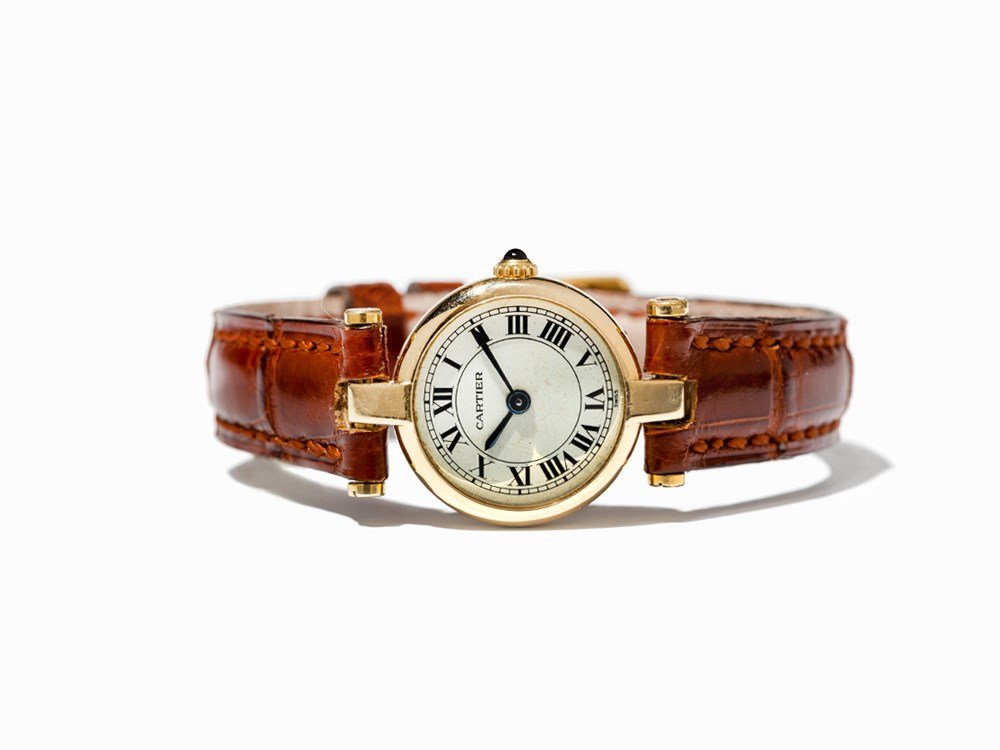 Cartier Ladies’ Watch, Switzerland, C. 1990: Cartier ladies’ watch Switzerland, c. 1990 Quartz movement, hour, minute Silver dial, blued hands Watch case of 18K gold Brown alligator leather strap with pin buckle Watch case no. 660101603; caboc