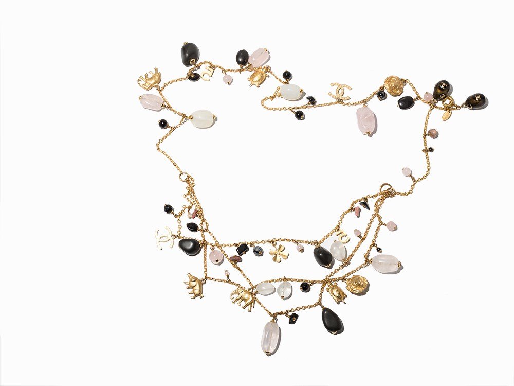 Chanel Multi-Charm Necklace & Belt, 2001: Golden colored hardware, CC chain link belt purple and grey resin beads France, 2001 Chanel - established French fashion company, founded by Coco Chanel (1883-1971) in 1909 With talismans such as pig,