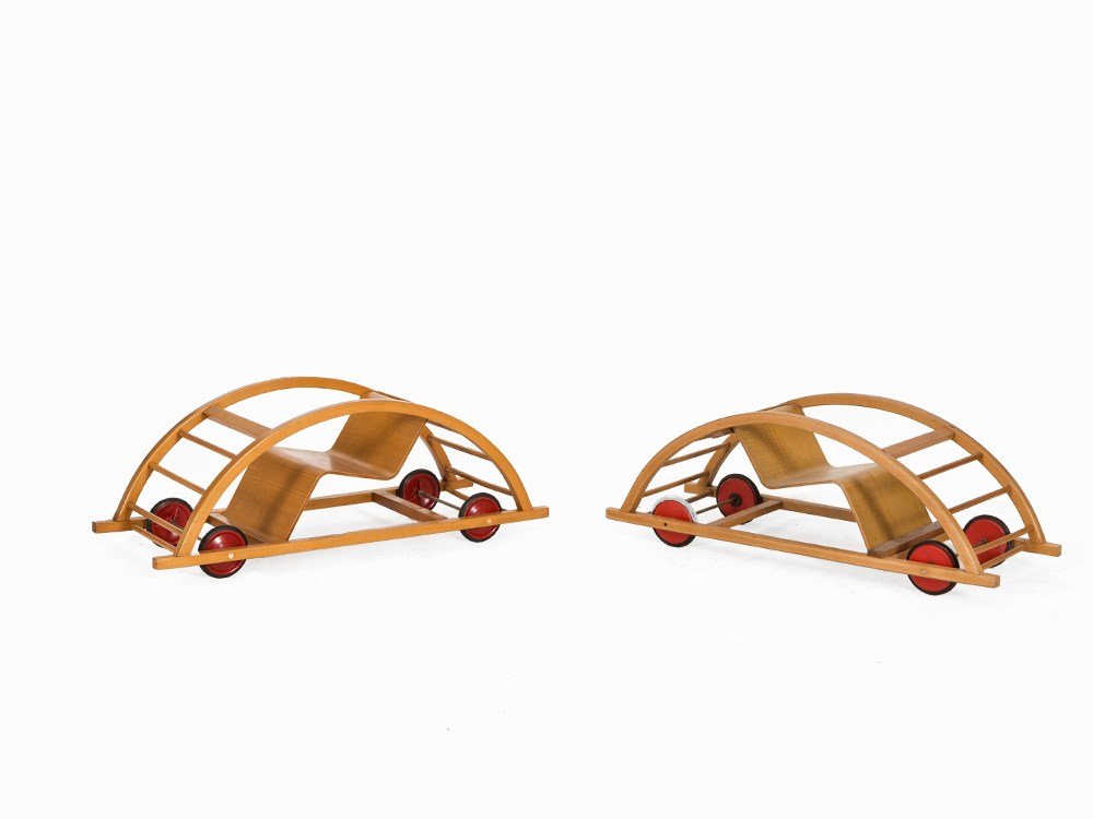 Hans Brockhage & Erwin Andrä, Pair Rocking Horses, 1951: Oak, varnished, plywood, tubular metal, rubber-frosted wooden wheels, lacquered red Germany, 1951 Design: Hans Brockhage (1925-2009) – German shaper and sculptor & Erwin Andrä (b. 1921) – German