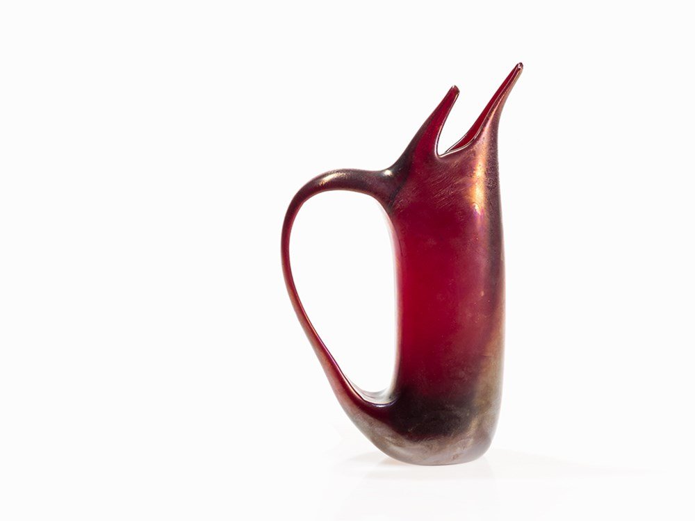Giorgio Ferro, Pitcher ‘Anse Volanti’, A.Ve.M, Murano,: Amethyst tinted glass, mat iridescent luster, base cut plane Murano, Italy, 1952 Design: Giorgio Ferro (b. 1931) – Italian glass artist Execution: Arte Vetreria Muranese A.Ve.M Curved, straight oval