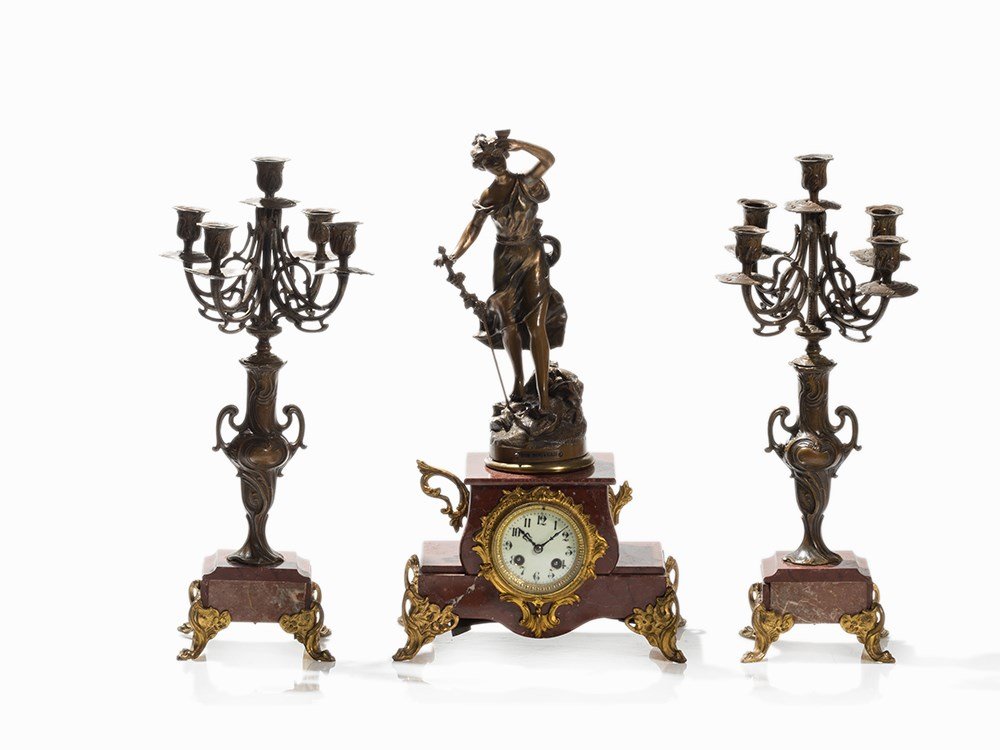 Fin de Sicle Fireplace Clock with 2 Candelabras, c.: Red marble, brass, partially gold-plated, tin and white cast, patinated, glass, enamel France, around 1890 Fin de Sicle Sculpture by Charles Ruchot (active 1880-1915) – French sculptor Round brass m