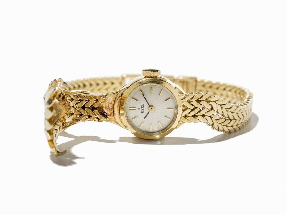 Ebel Bracelet Ladies’ Watch With Gold Top, C. 1970: Ebel Bracelet ladies’ watch with gold top Switzerland, c. 1970 Manual wind movement, calibre 055; hour, minute Silver dial, black hands Watch case, strap and folding clasp of 18K gold Watch case no.