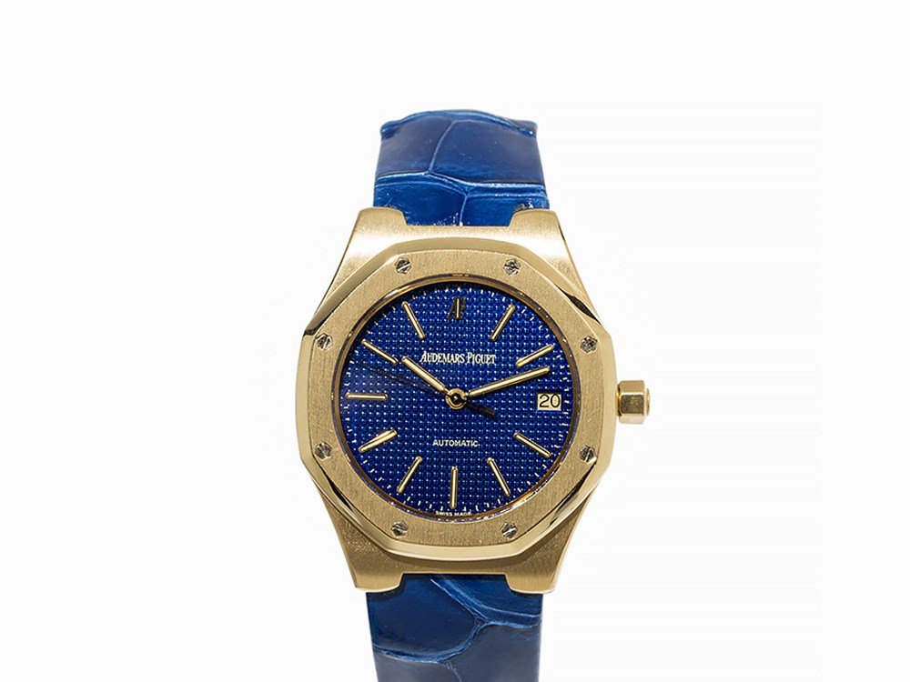 Audemars Piguet Royal Oak, Switzerland, C. 1995: Audemars Piguet Royal Oak, no. 972 Switzerland, c. 1995 Automatic movement, hour, minute, second, date Navy blue, waffled dial, gold luminescent hands Watch case and original folding clasp of 18K gold