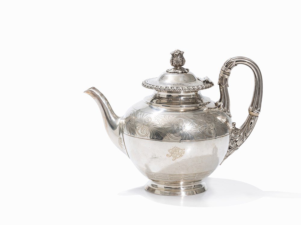 A Silver Teapot, Stephen Smith & William Nicholson,: Sterling silver, embossed, chased, engraved and cast London, 1858 Stephen Smith & William Nicholson (active c. 1850-1863) - Silversmiths in London Maker’s mark, silver standard mark, city mark, duty