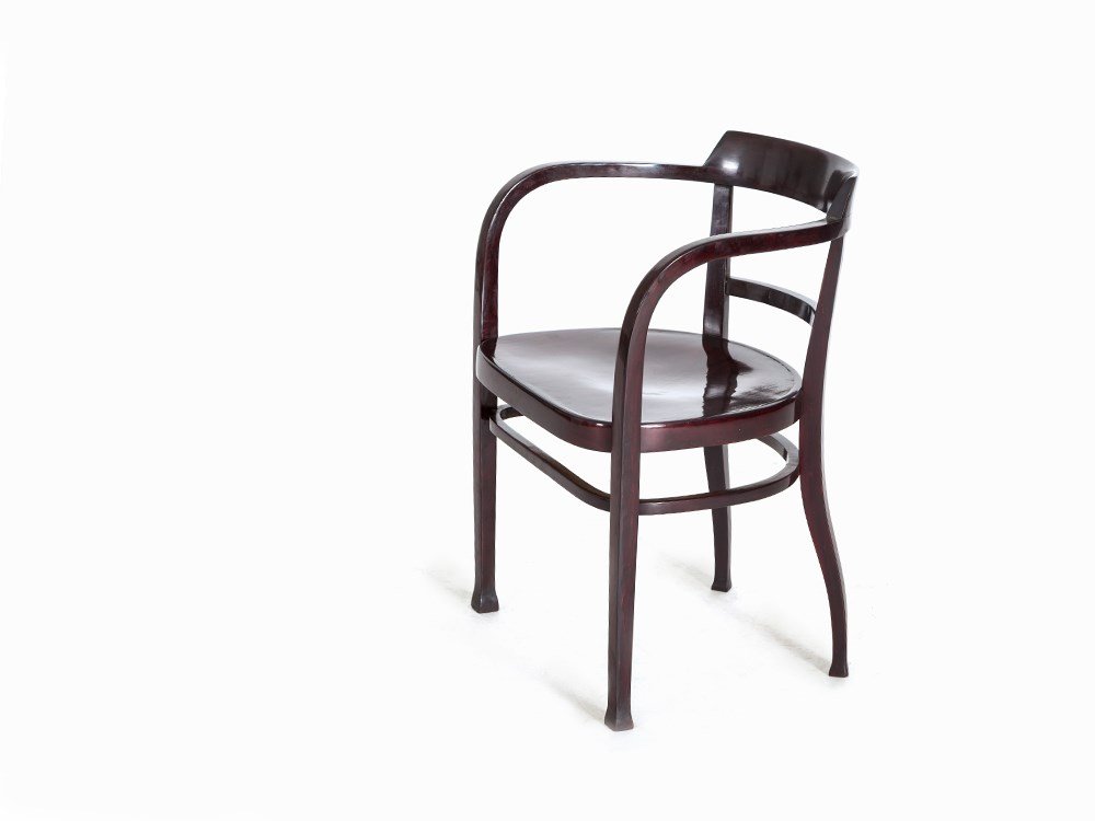 Thonet, Armchair, Austria, c. 1910: Bentwood, stained in mahogany color Austria, um 1910 Manufacturer: Thonet – Bentwood manufactory, established in 1819 by Michael Thonet Under the front frame a blackened impressed mark ‘Thonet’