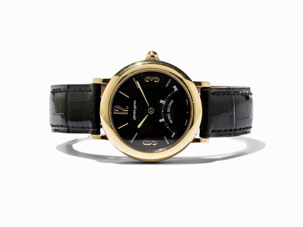 Gérald Genta Retro Second Gold Wristwatch, Ref. G 3610,: Gérald Genta Retro Second gold wristwatch, ref. G 3610 Switzerland, c. 2002 Automatic movement, hour, minute, retrograde second Black dial, gold luminescent hands Watch case and original pin buckle o