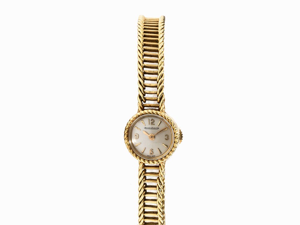 Jaeger-LeCoultre, Small Ladies’ Watch, Switzerland, c.: Jaeger-LeCoultre, small ladies’ watch Switzerland, c. 1960 Manual wind movement, hour, minute Silver dial, gold hands Watch case, strap and folding clasp of 18K gold Watch case no. 136495 A Dedicati