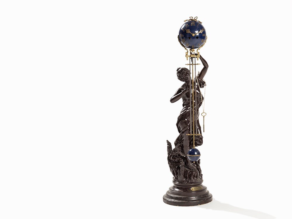 A 'Mystérieuse' Clock 'La Fleur des Glaciers', France,: Spelter with dark brown patina, brass, metal, partially with blue lacquer France, c. 1900 Sculpture designed by Julien Caussé (1869-?) – French sculptor Signed in the cast ‘J. Caussé’ Brass la