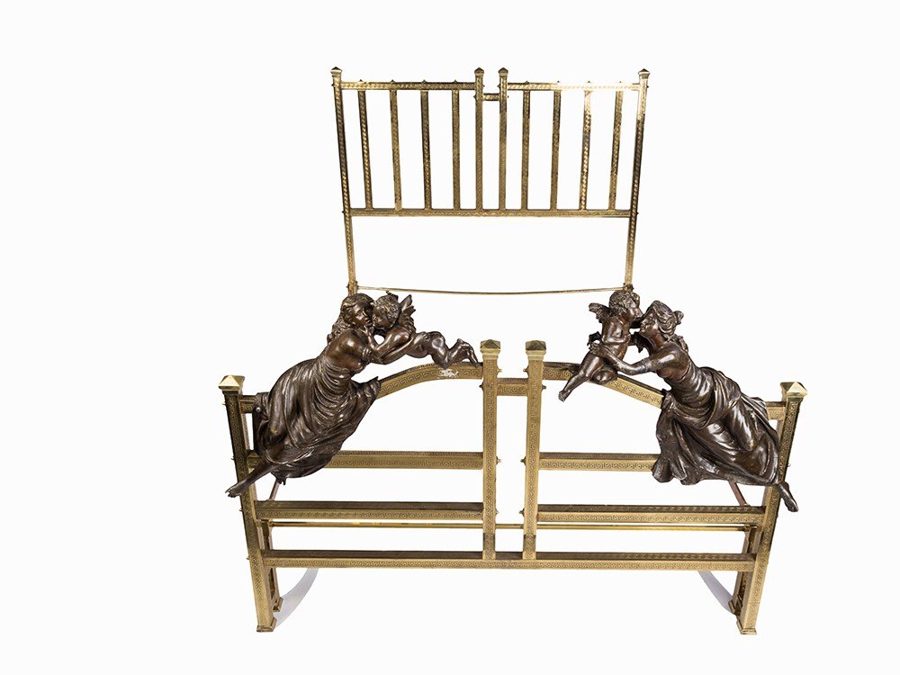 A Brass Bed Frame with Figural Ornament, 19th/20th C.: Brass frame with bronze paint 19./20. Jahrhundert The square brass frame and splats with key pattern banding and tent shaped finials to the four corner posts The arched divided gate style bed end with
