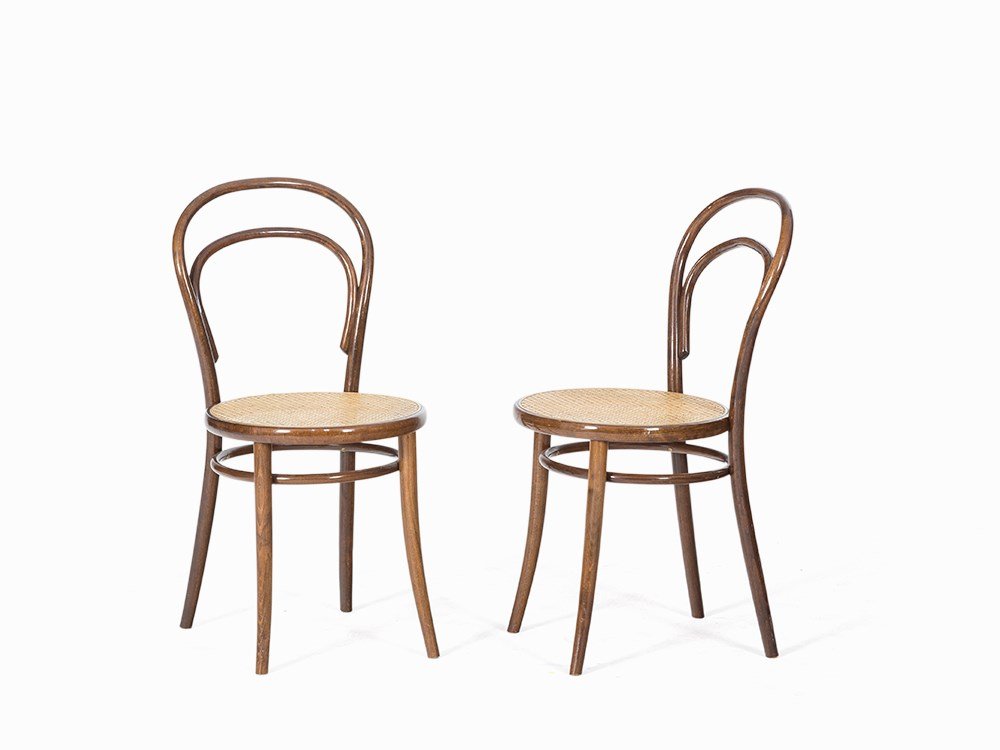 Thonet, Pair of Bistro Chairs, Bentwood, Austria, after: Bentwood, canework Austria, after 1945 Thonet – Bentwood manufactory, established in 1819 by Michael Thonet Both labeled underneath the seat ‘THONET’ Circular seat above hoop stretcher Round, fa