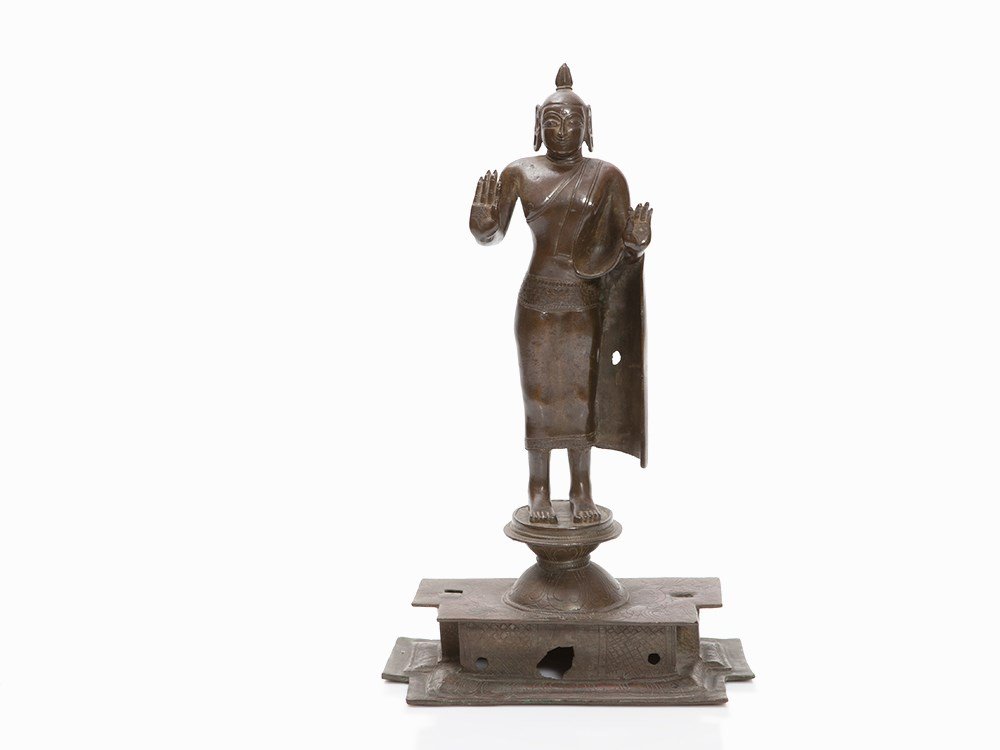 Bronze Buddha with Abhaya and Vitarka Mudra, Sri Lanka,: Copper bronze, patinated Sri Lanka, 17th century Right hand with abhaya mudra – gesture of fearlessness and protection Left hand with vitarka mudra –gesture of teaching Standing on a lotus throne 