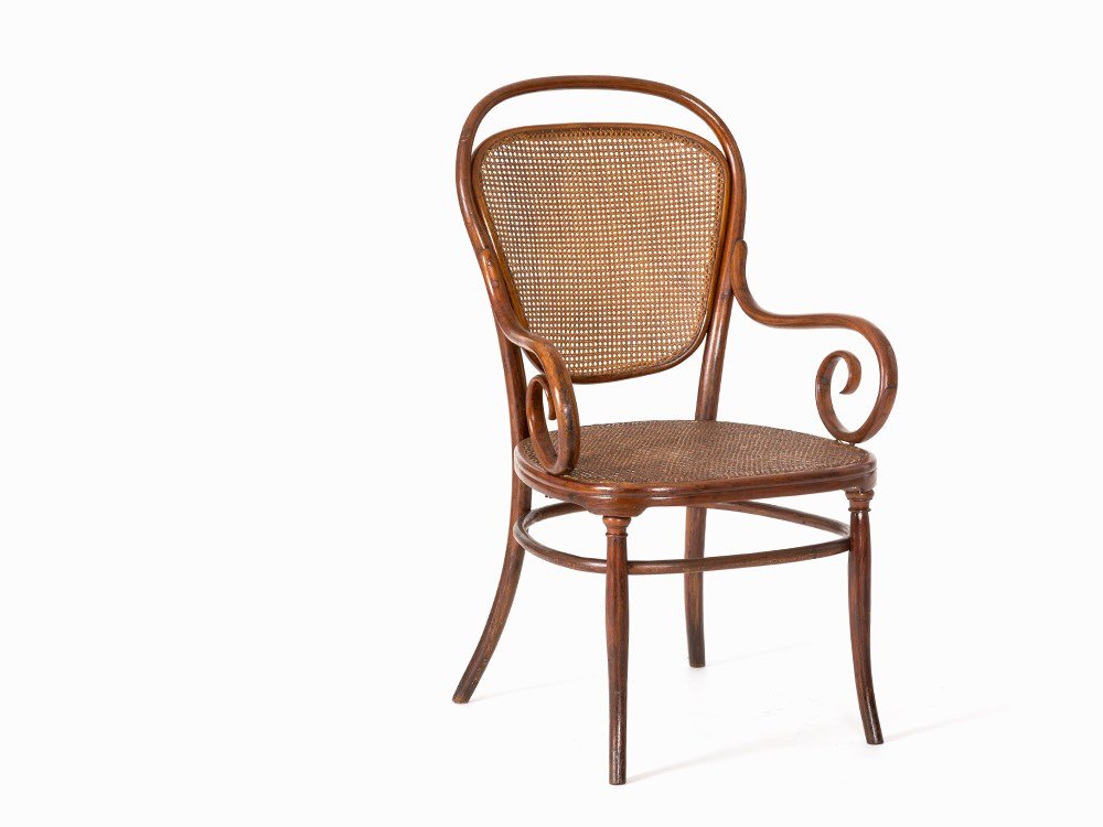 Thonet, Armchair No. 12, Vienna, c. 1890: Beech bentwood, partially turned, brownish stained, seat and back with Vienna wickerwork Vienna, Austria, c. 1890 Manufacturer: Thonet – Bentwood manufactory, est. in 1819 by Michael Thonet Manufact