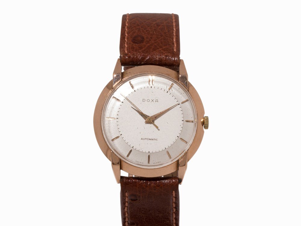 Doxa Automatic Vintage Gold Wristwatch, 1965: Doxa Automatic vintage gold wristwatch Switzerland, c. 1965 Automatic movement, calibre 11’’’; hour, minute, second Silver dial, gold hands Watch case of 14K rose gold Brown calfskin leather str