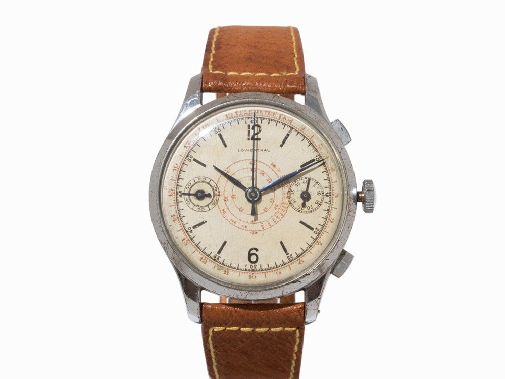 Lowenthal Chronograph, c. 1945: Lowenthal chronograph Switzerland, c. 1945 Manual wind movement; hour, minute, second, chronograph Silver dial, blued hands Watch case of stainless steel Brown leather strap with pin buckle Watch case