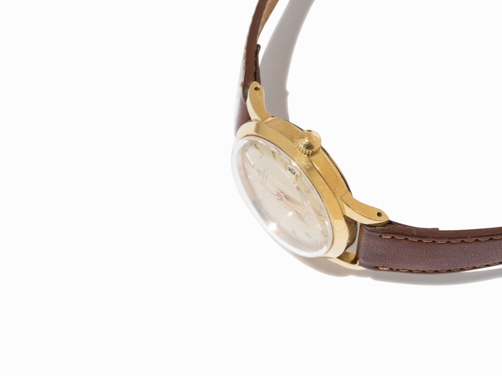 Bucherer Date Incabloc, c. 1950: Bucherer Date Incabloc Schweiz, c. 1950 Automatic movement, Felsa 692; 30 jewels, hour, minute, second, date White dial, gold Dauphine hands Watch case of 18K gold Brown leather strap with pin buckle