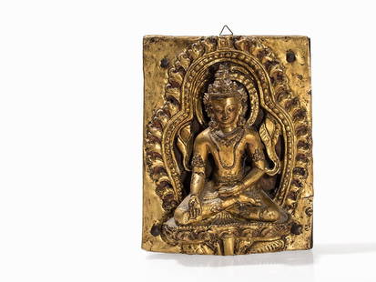 Gilt Bronze Repoussé Relief of a Bodhisattva, 18th C.: Gilt metal repoussé relief on wooden plate Tibet/Nepal, 18th century or earlier Bodhisattva in meditation on a lotus, embedded in an ornate niche, the left hand placed in the lap, the right hand perf