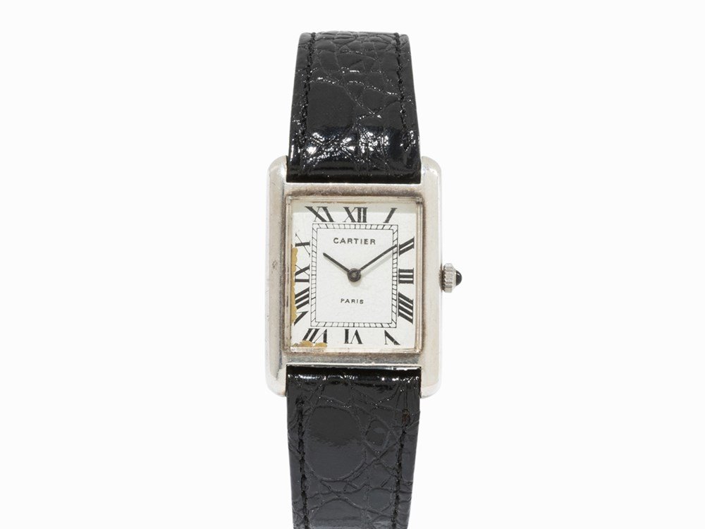 Cartier Sterling Silver Tank Solo Watch, Switzerland,: Cartier 925 sterling silver Tank Solo wristwatch Manual wind up movement; hour, minute White dial, blued hands 925 sterling silver watch case Black leather strap with pin buckle Watch case with finene