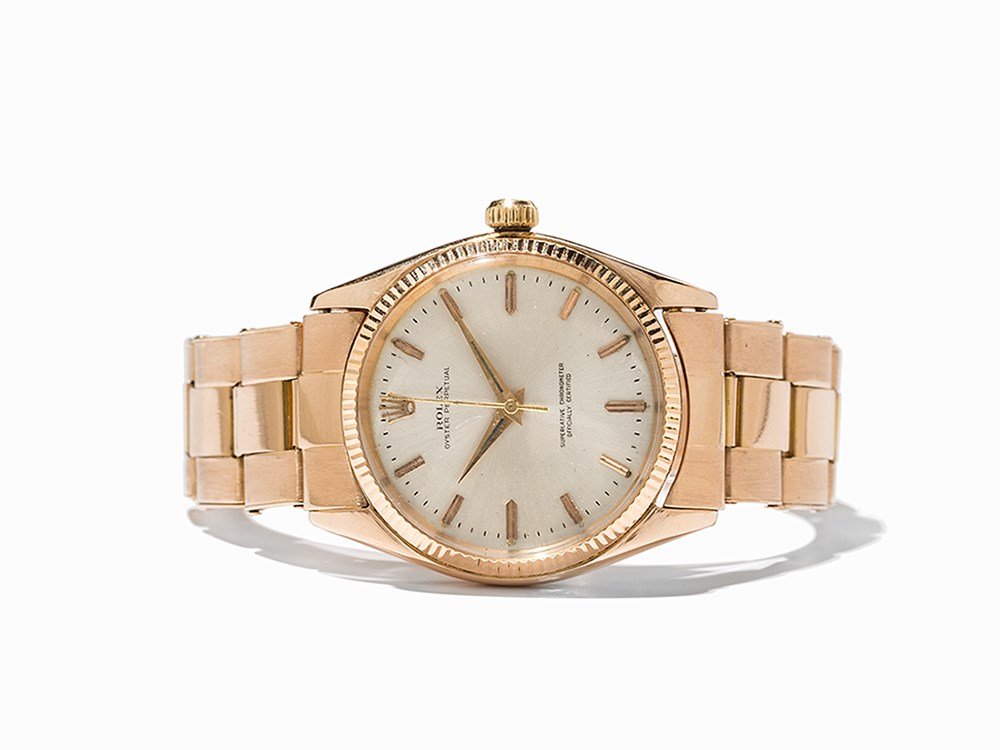 Rolex Oyster Perpetual Gold, Ref. 1005, Switzerland, C.: Rolex Oyster Perpetual gold, ref. 1005 Switzerland, c. 1965 Automatic movement, calibre 1560; 25 jewels, hour, minute, second Silver dial, gold hands Watch case, original strap and folding clasp of 18